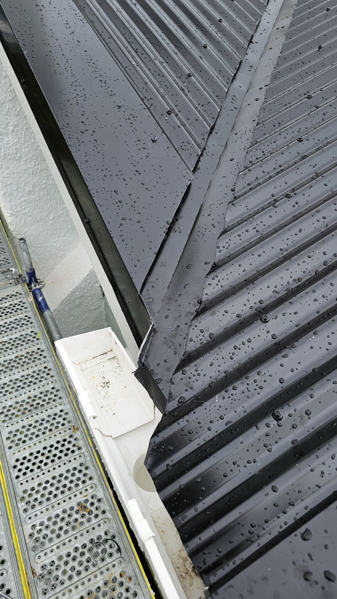 Flashing detail on a new steel roof, photographed during a roof assessment